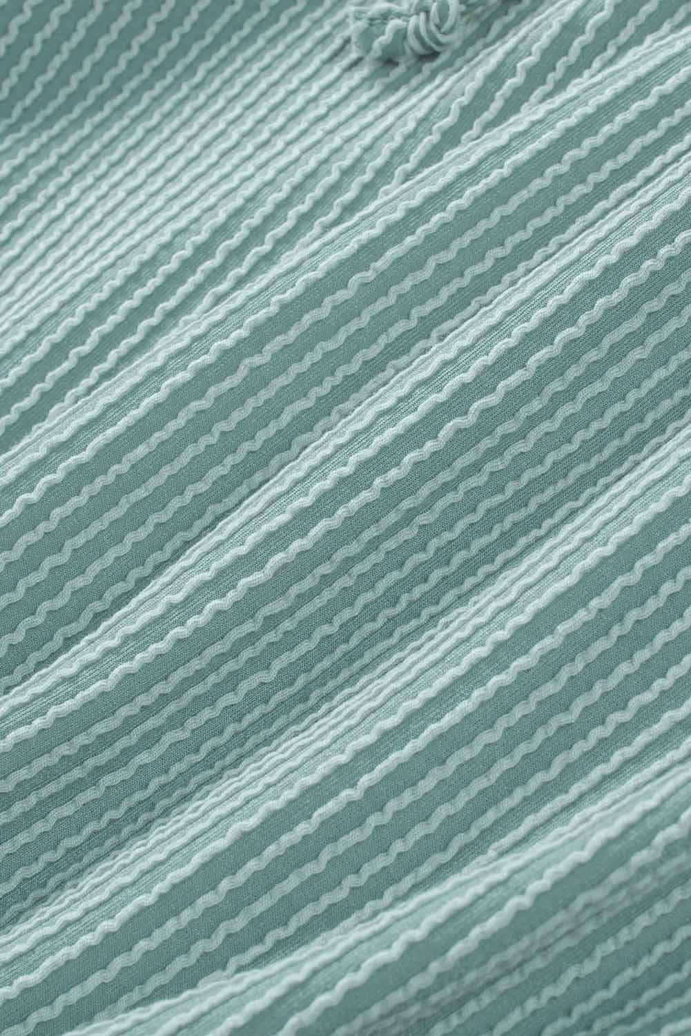 Sudadera con capucha holgada y cuello en V de canalé