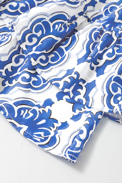 Robe Ashleigh bleue à imprimé floral vintage et manches larges à volants