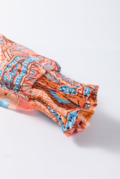 Chemise ample boutonnée à imprimé floral orange et poignets froncés