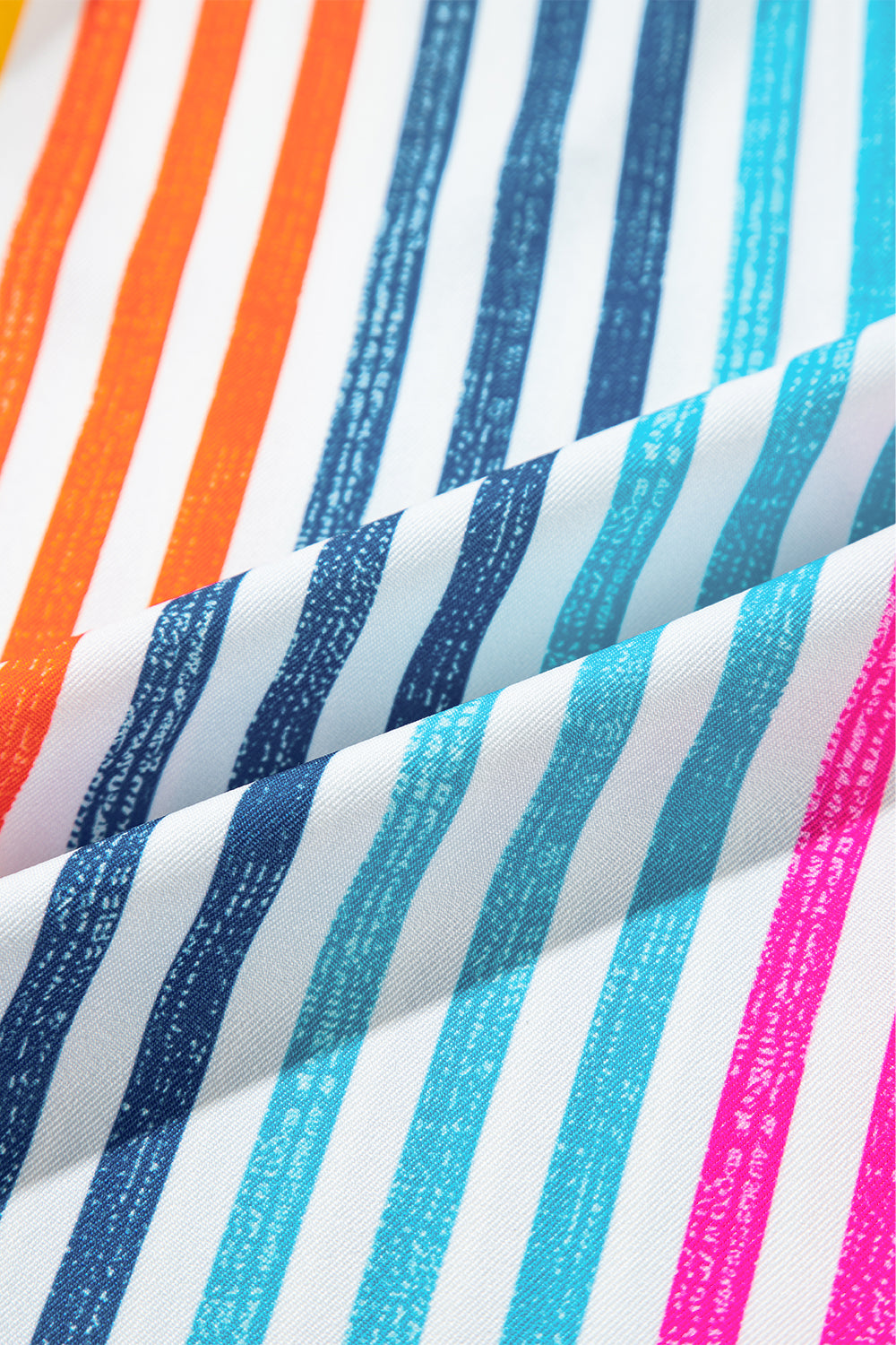 Chemise ample à rayures orange multicolores et épaules tombantes