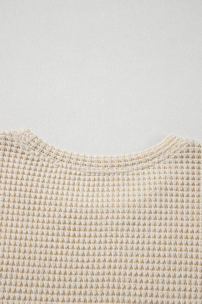 Chemisier péplum beige à imprimé floral gaufré et manches courtes à volants