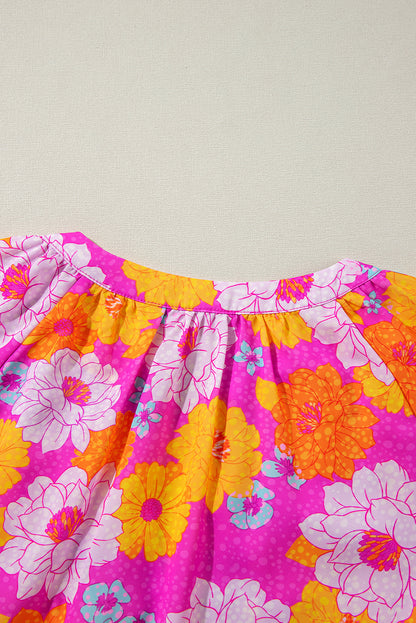 Chemisier à imprimé floral rose, manches volantées et col cranté