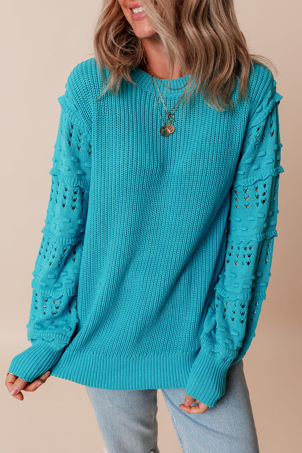 Pull turquoise à volants et manches bouffantes
