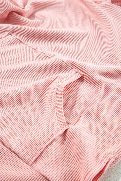 Sweat à capuche surdimensionné rose clair en tricot gaufré doublé polaire à col montant