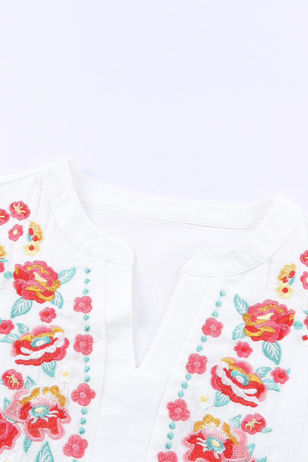 Blusa de manga farol con volantes y bordado floral 