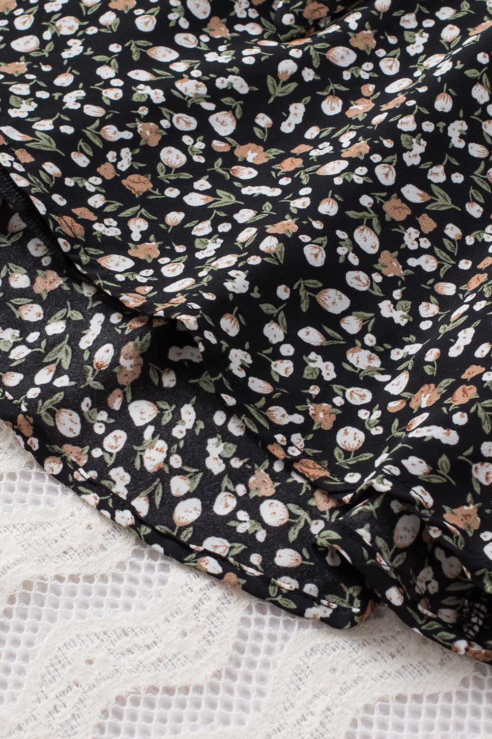 Blusa de manga larga con volantes y lazo delantero con estampado floral