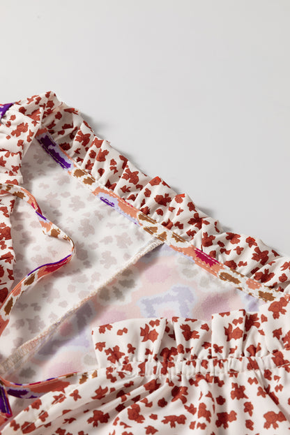 Chemisier orange à manches longues et col en V noué à imprimé floral mixte