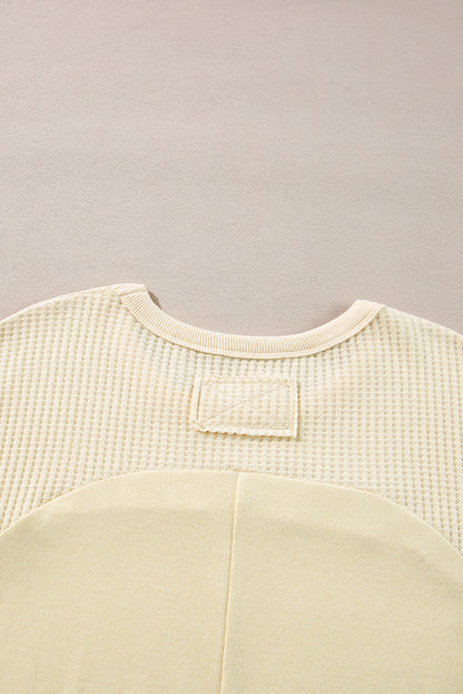 Haut beige à manches longues en tricot thermique avec coutures apparentes