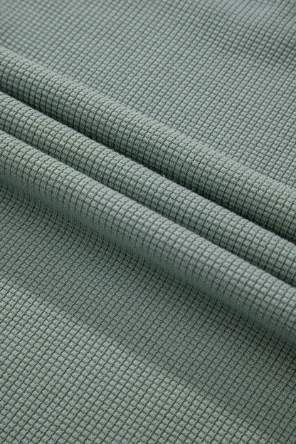 Haut à col en V et épaules tombantes en tricot gaufré Clearly Aqua