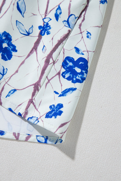 Chemisier péplum beige à imprimé floral gaufré et manches courtes à volants