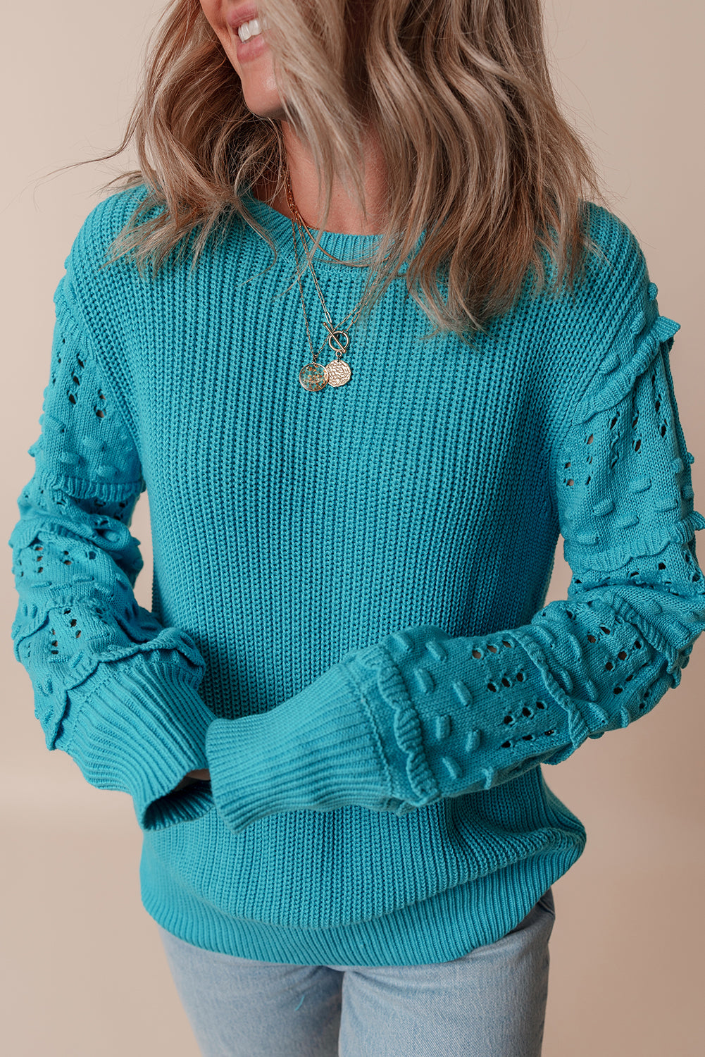 Pull turquoise à volants et manches bouffantes