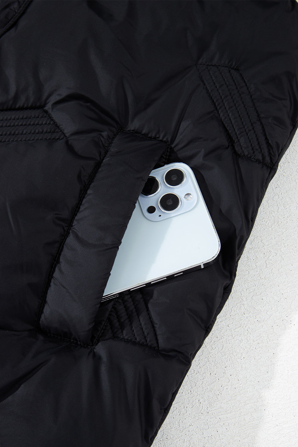 Veste matelassée noire à col montant et fermeture éclair