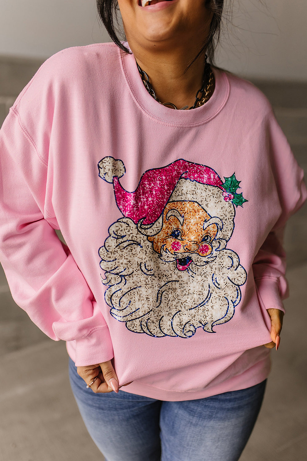Sweat-shirt rose à épaules tombantes et motif Père Noël audacieux