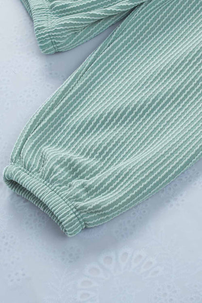 Sudadera con capucha holgada y cuello en V de canalé