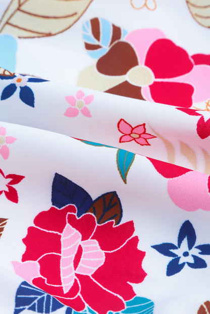 Robe fleurie à volants, col montant, sans manches, à volants et à volants