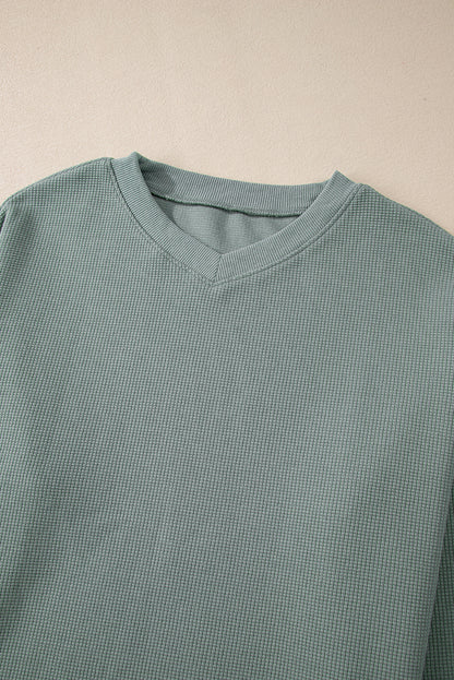 Haut à col en V et épaules tombantes en tricot gaufré Clearly Aqua