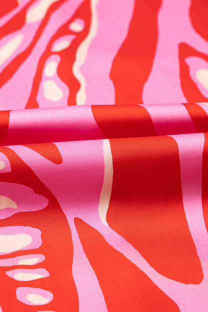 Chemisier surdimensionné rouge à imprimé abstrait, col en V et manches chauve-souris