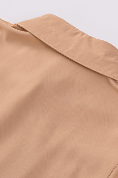 Chemisier boutonné à manches bouffantes de couleur unie