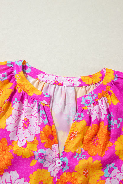 Chemisier à imprimé floral rose, manches volantées et col cranté