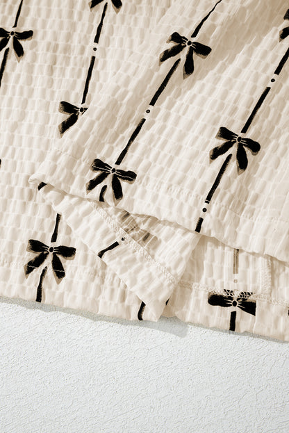 Haut à manches courtes bouffantes et imprimé nœud beige