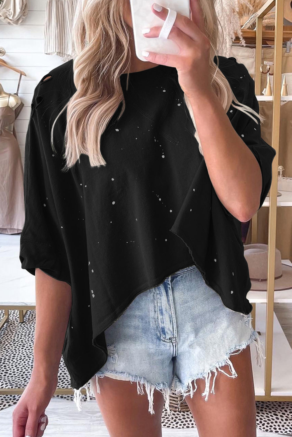 Haut à manches courtes et ourlet asymétrique délavé et vieilli