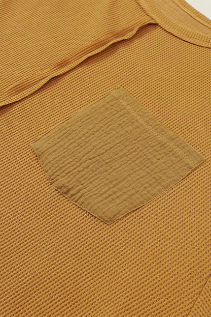 Haut en tricot gaufré à manches bouffantes et coutures apparentes