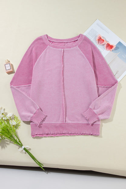 Sweat-shirt raglan rose en maille gaufrée avec coutures apparentes