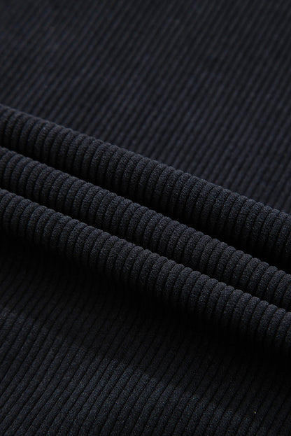 Veste-chemise noire en velours côtelé avec capuche et poches à cordon