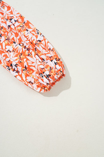 Robe mi-longue orange à imprimé floral, col en V, manches bouffantes, grande taille