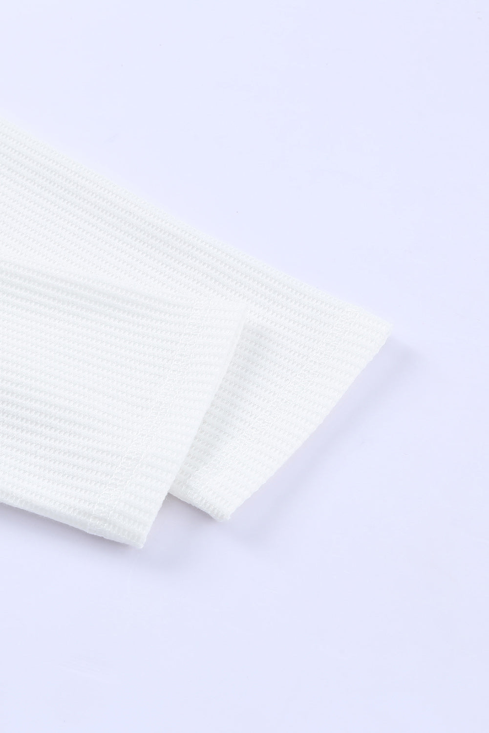 Top henley de punto gofre con medio botón 