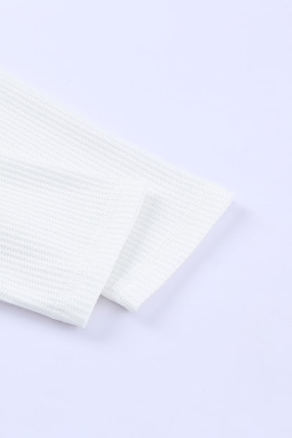 Top henley de punto gofre con medio botón 