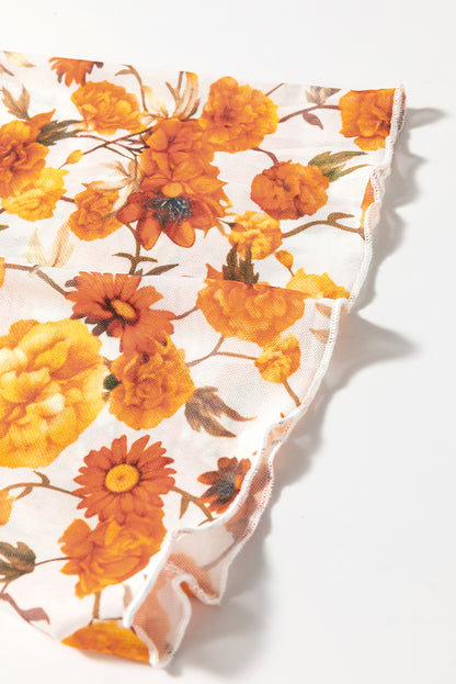 Chemisier orange à imprimé floral, manches cloche, col montant, bordure festonnée