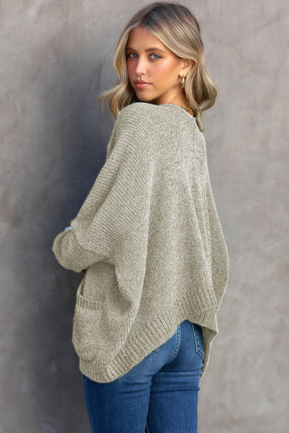 Cardigan gris à poches sur le devant et boutons 