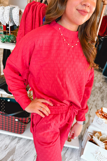 Ensemble pull-over et pantalon texturés à carreaux rose fraise