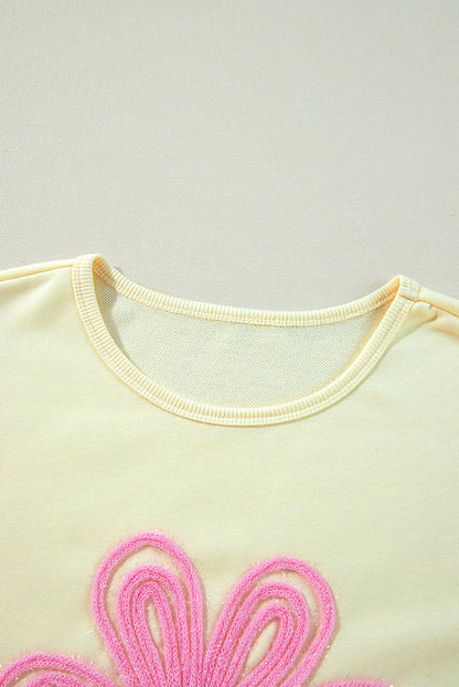 Sweat-shirt beige à manches bouffantes et fleurs en guirlandes