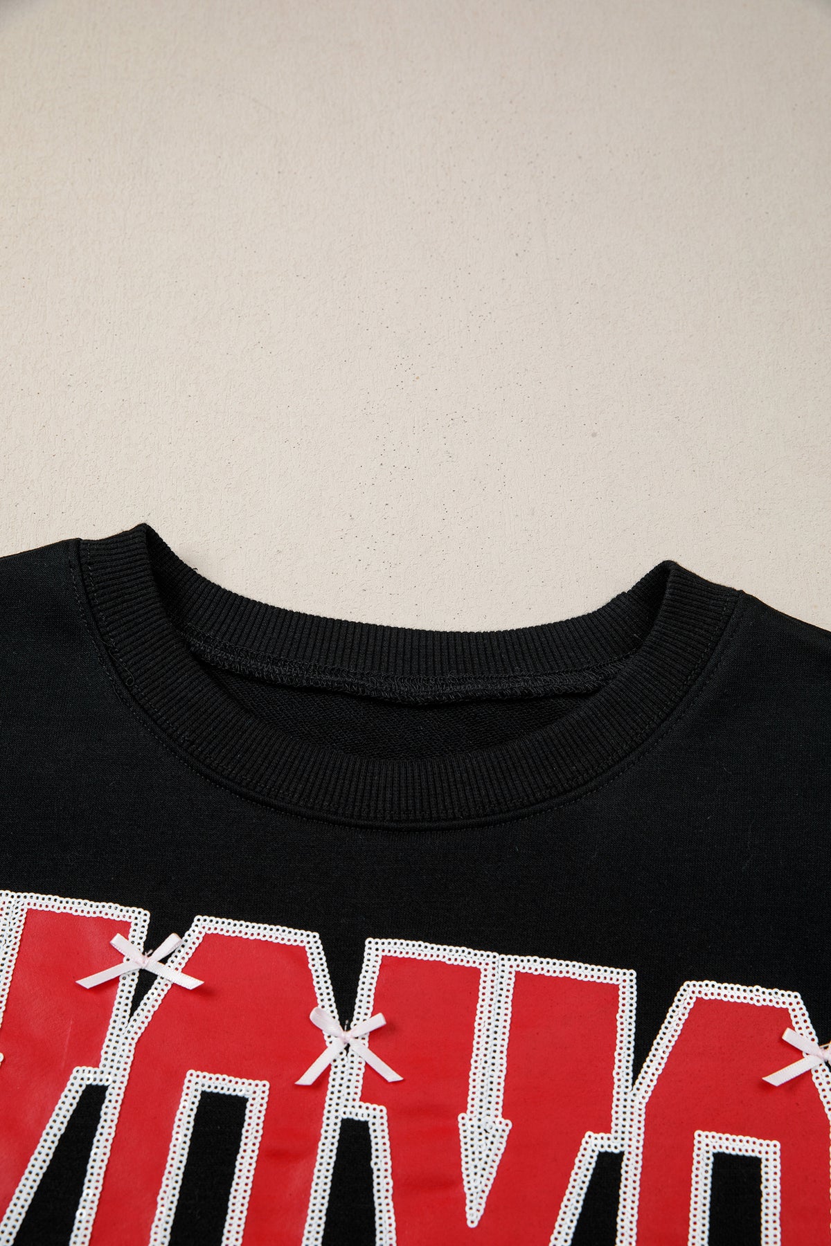 Black Bow Sequin XOXO Letter Graphic Exposed Seam Baggy Sweatshirt
