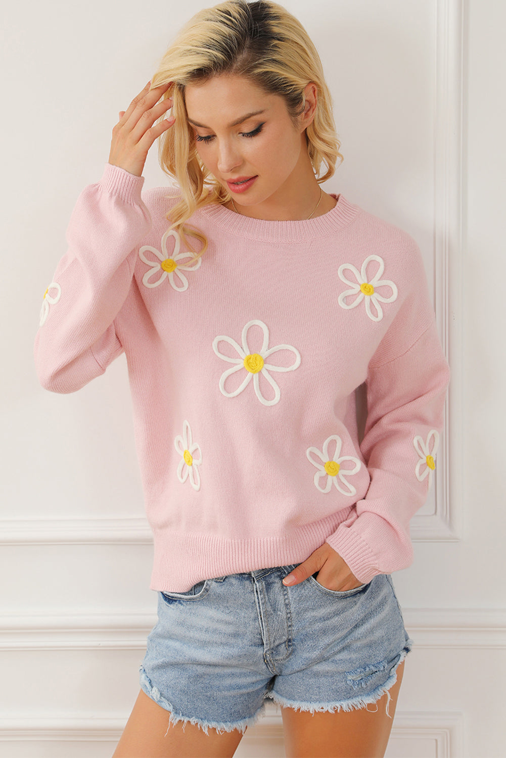 Pull ras du cou rose en chenille avec coutures marguerites 