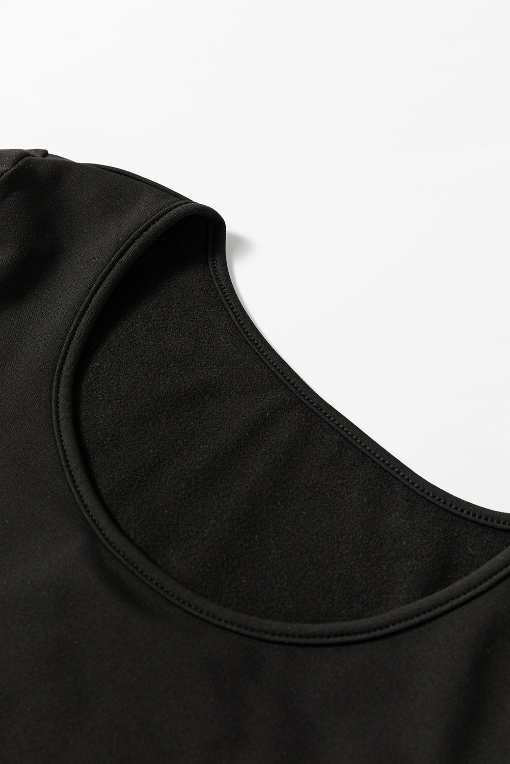 Haut thermique noir uni à col rond et coupe slim