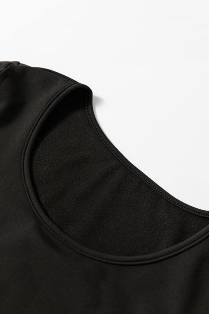 Haut thermique noir uni à col rond et coupe slim