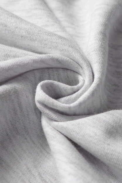 Mini-jupe en molleton gris clair avec cordon de serrage et poches