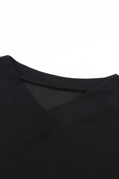 Pull violet en tricot à col en V et poignets boutonnés