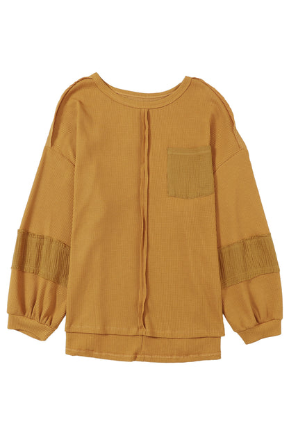 Haut en tricot gaufré à manches bouffantes et coutures apparentes