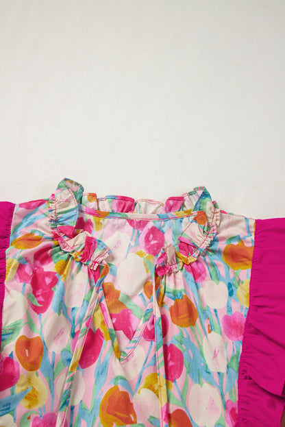 Chemisier rose à volants superposés et col en V avec manches flottantes