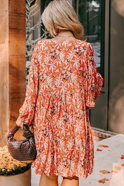 Robe mi-longue orange à imprimé floral, col en V, manches bouffantes, grande taille