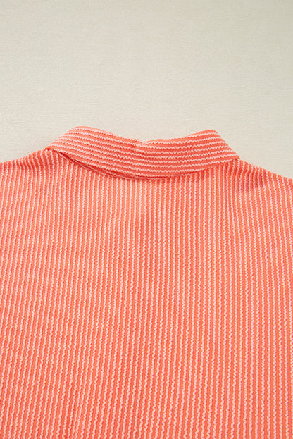 Chemise ample à manches mi-longues et ourlet haut-bas boutonné, couleur pamplemousse orange