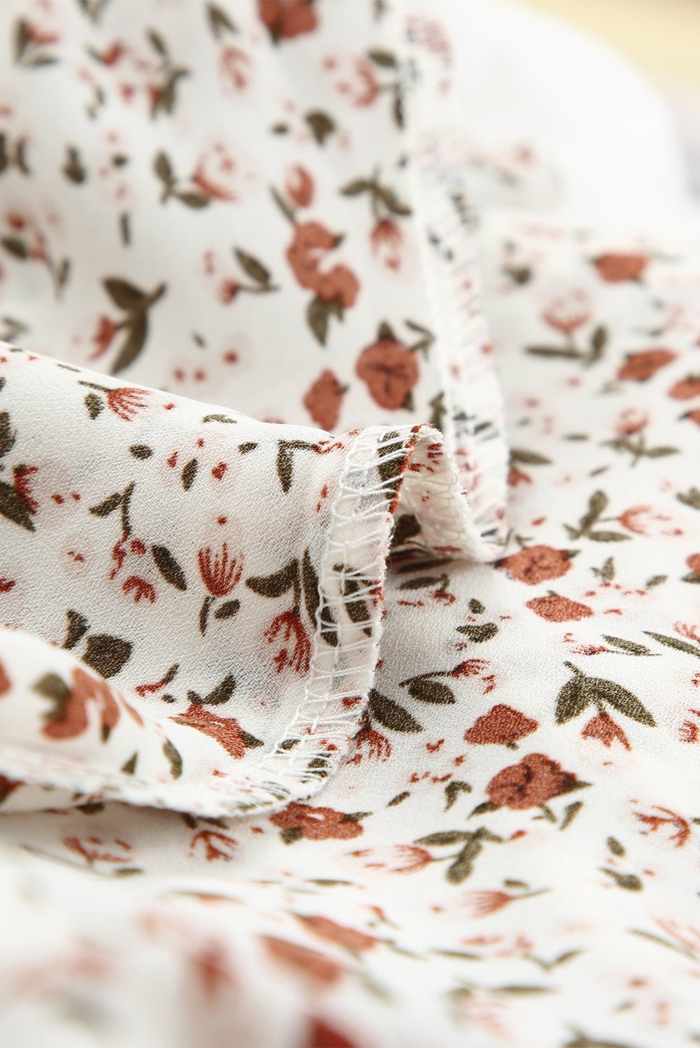 Blusa de manga larga con volantes y lazo delantero con estampado floral