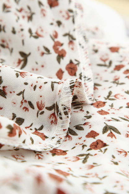 Blusa de manga larga con volantes y lazo delantero con estampado floral