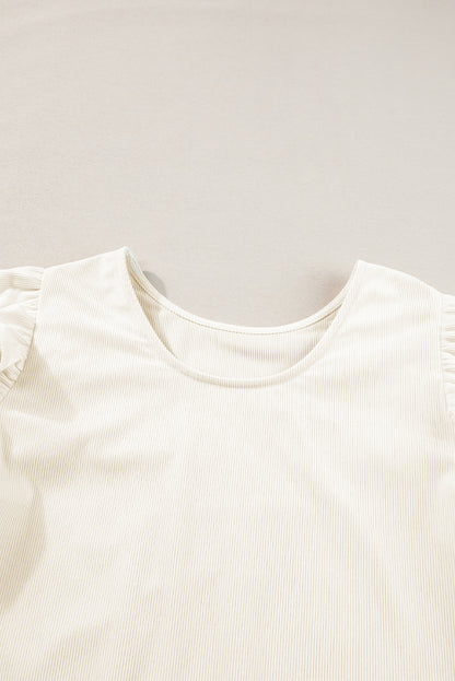 Chemisier beige en velours côtelé à volants et manches volantées