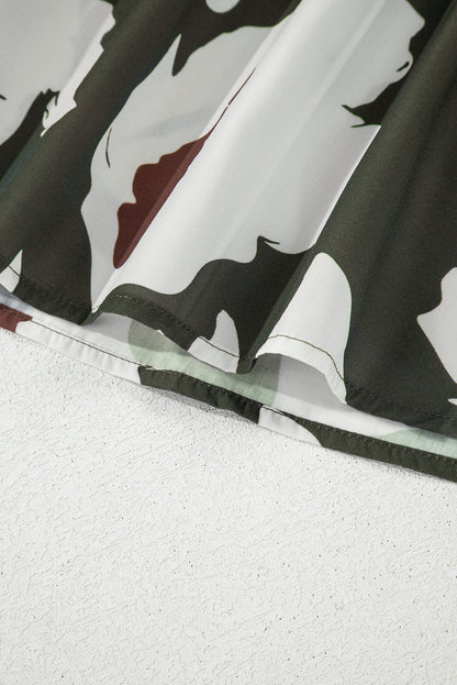 Chemisier à manches bouffantes et demi-bouton à imprimé floral abstrait trèfle à quatre feuilles