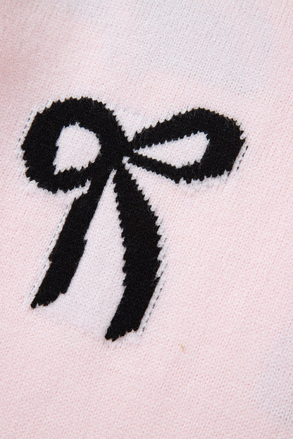 Pull ample en maille rose clair à motif nœud